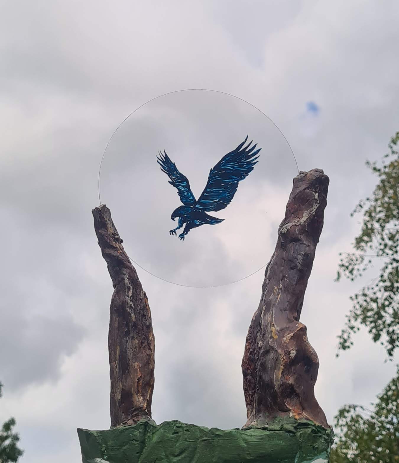 Two clay stones embrace a lens to beyond